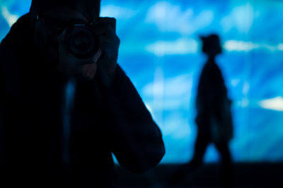 Close-up of man standing against sky