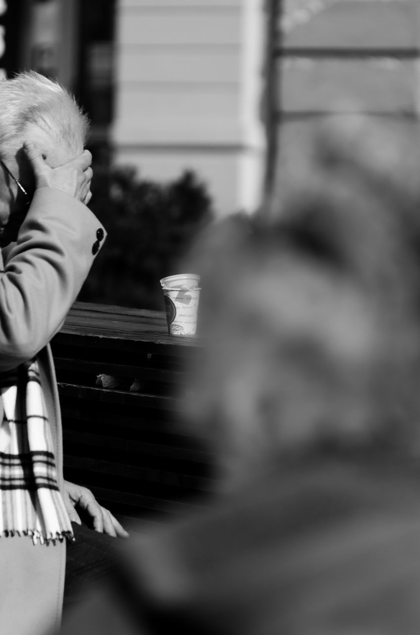 REAR VIEW OF COUPLE KISSING