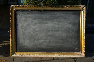 Close-up view of blank blackboard in sunlight 