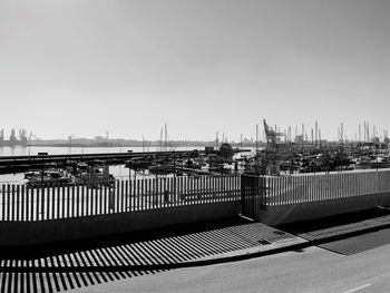 Bridge over river against buildings in city