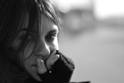 Close-up portrait of young woman with black hair