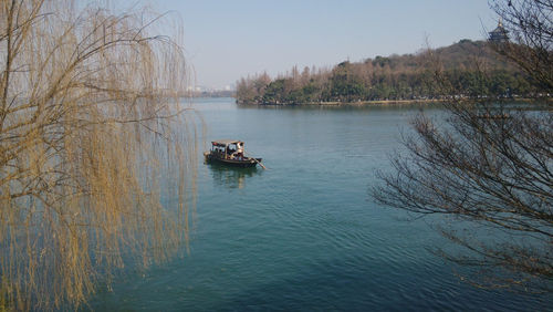 People on boat in lake