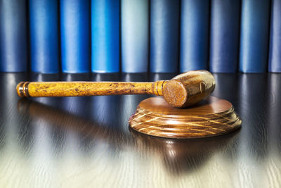 High angle view of gavel on wooden table