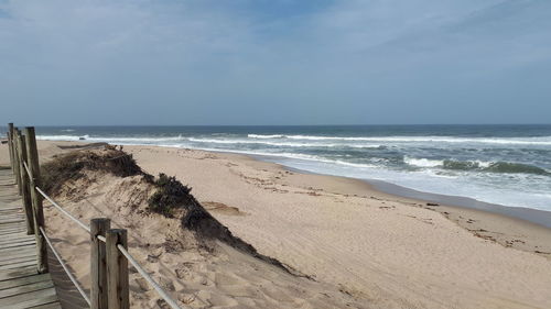 Scenic view of beach against sky