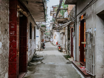 Narrow alley along buildings