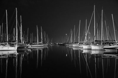 Boats moored at harbor