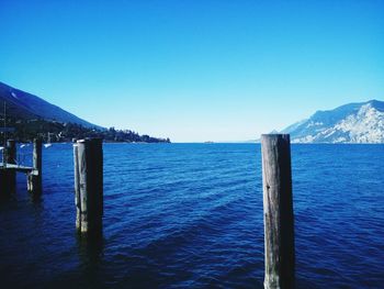 Scenic view of sea against clear blue sky