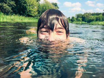 Surface level view of boy in river