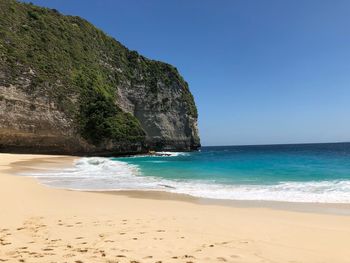 Scenic view of sea against clear blue sky