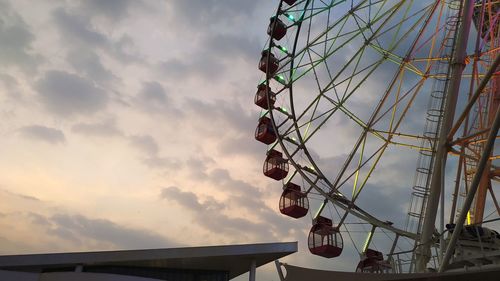 Low angle view of ferris wheel against sky