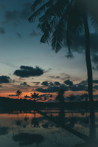Scenic view of lake against sky at sunset