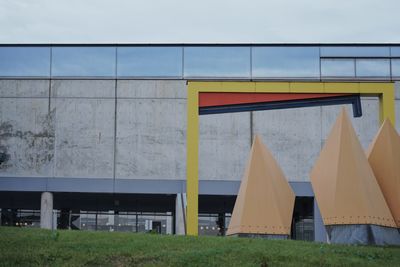 Built structure on field against sky