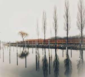 Scenic view of lake against sky during winter