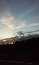 Silhouette of trees against sky at sunset