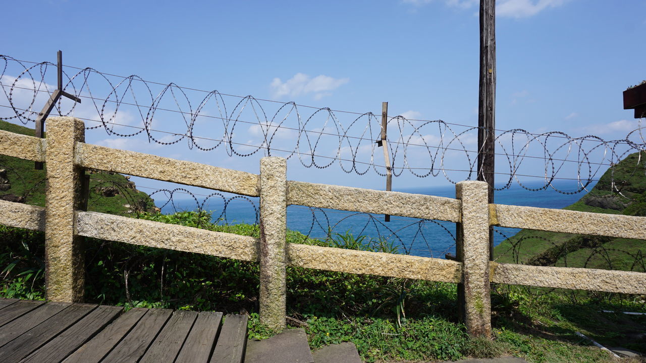 FENCE AGAINST SKY