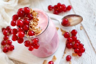 High angle view of red berries on table