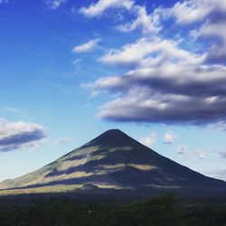 Scenic view of volcanic mountain against sky