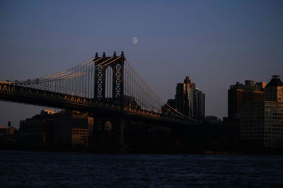 Suspension bridge over river in city