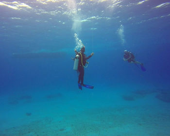 People swimming in undersea