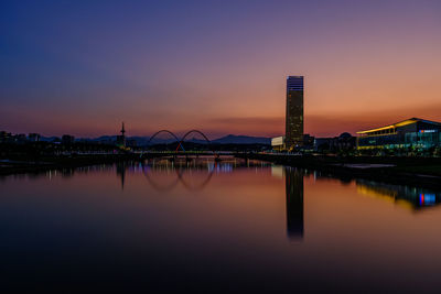 Reflection of illuminated buildings in water
