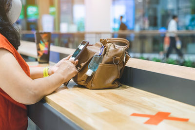 Close-up of woman holding smart phone