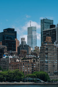 Buildings in city against sky