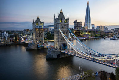 Bridge over river with buildings in background