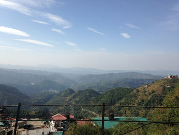 Scenic view of mountain against cloudy sky