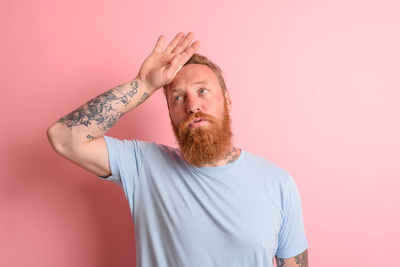 Man holding ice cream cone at home