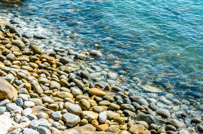 High angle view of pebbles on beach