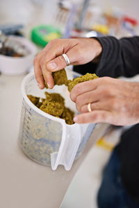 Midsection of man preparing food