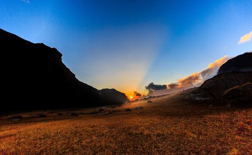 Scenic view of mountains against sky during sunset