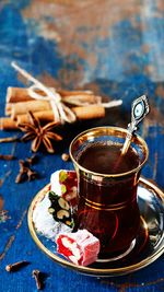 Close-up of drink with sweet food on table