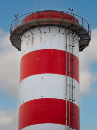 Higher end of an industrial chimney in red and white