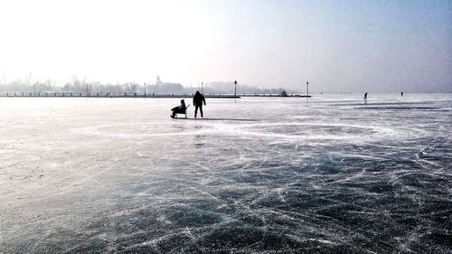 Scenic view of frozen lake against sky