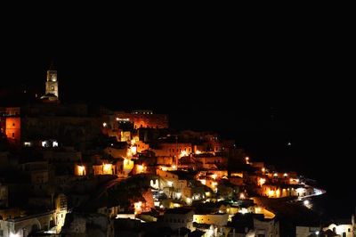 High angle view of illuminated buildings in city at night