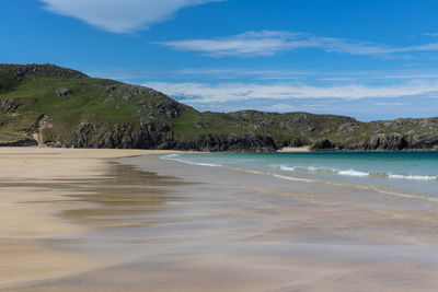 Scenic view of beach against sky