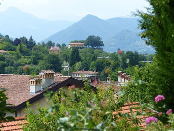 High angle view of houses and mountains against sky