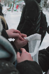 Bandaging a finger in winter on a person