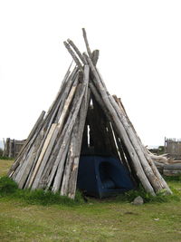 Low angle view of tent on field against sky