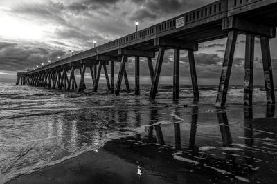 Pier over sea against sky