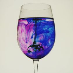 Close-up of multi colored object over white background