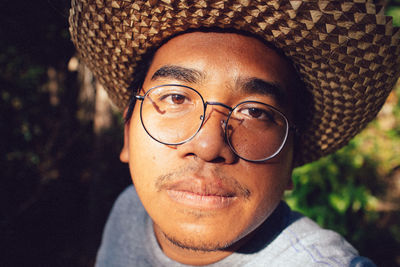 Close-up of man wearing hat