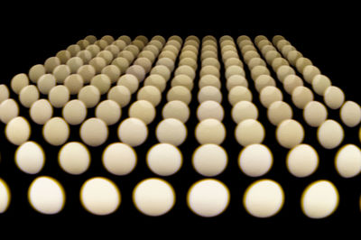 Close-up of illuminated lights against black background