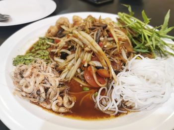 Close-up of noodles served in plate on table