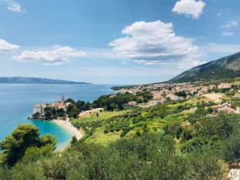 Panoramic view of townscape by sea against sky