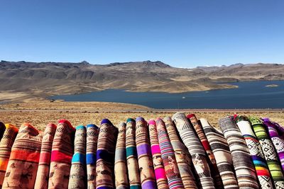 Stack of multi colored stones against clear sky