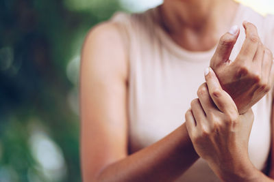 Close-up of woman holding hands