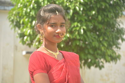 Portrait of smiling girl standing outdoors