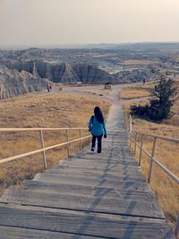 High angle view of woman walking on steps at badlands national park